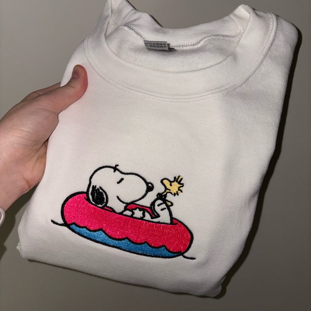 White Snoopy Sweatshirt with Pink and Yellow Accents